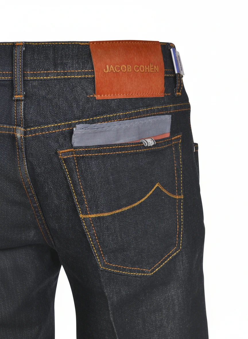 Close‑up detail of jeans narrow leg wash blue scur Jacob Cohen