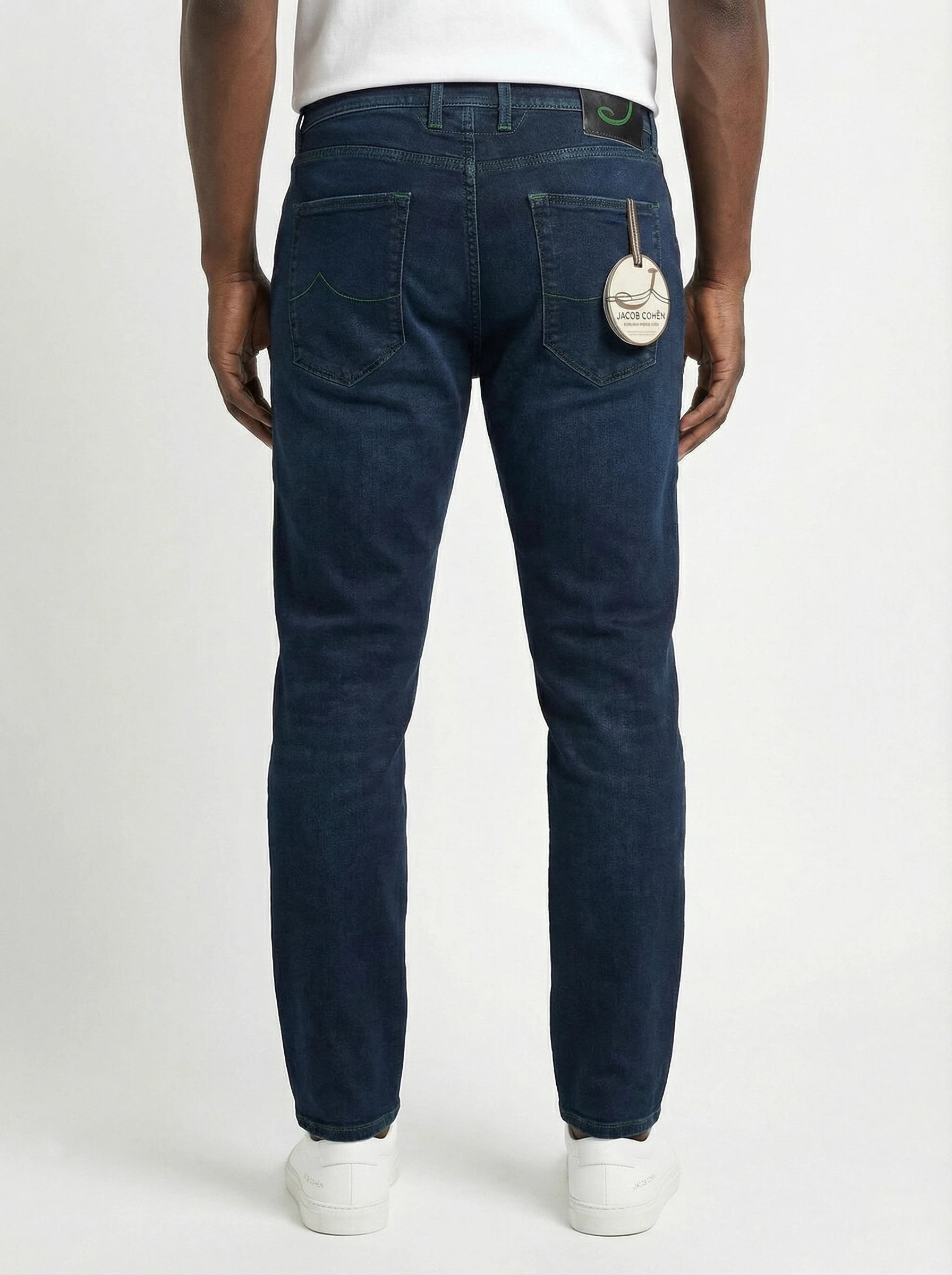 Back view of model wearing slim‑fit jeans dark wash Jacob Cohen in premium fabric