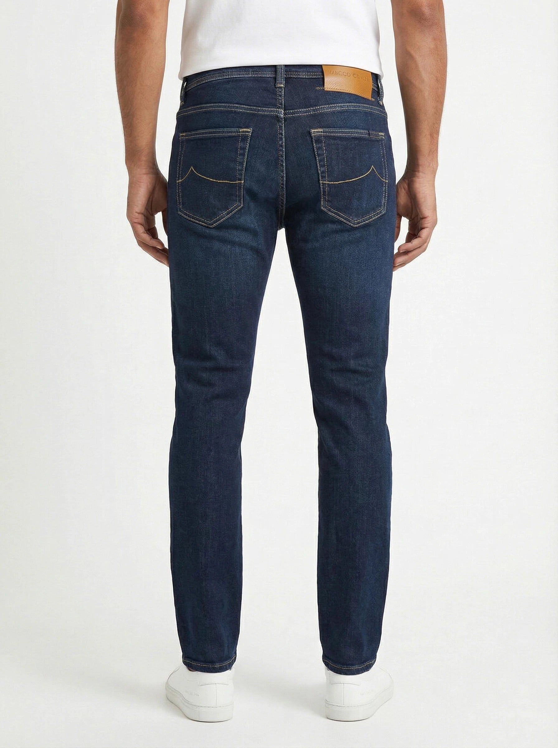 Back view of model wearing slim‑fit jeans denim scuro Jacob Cohen stretch fabric