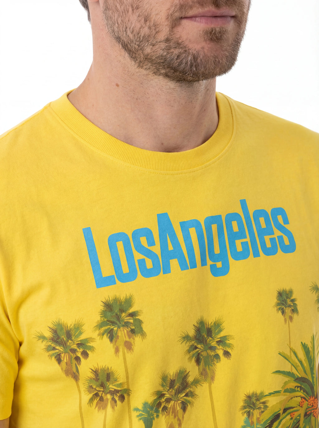 T-shirt su sfondo neutro da dietro t-shirt giallo scritta “Los Angeles” Saint Barth cotone