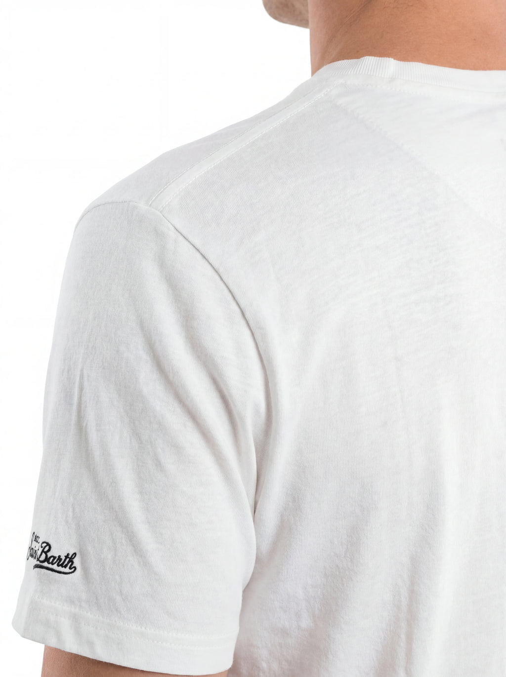 T-shirt su sfondo neutro frontale t-shirt bianco scritta “St. Barth COBRA” Saint Barth cotone