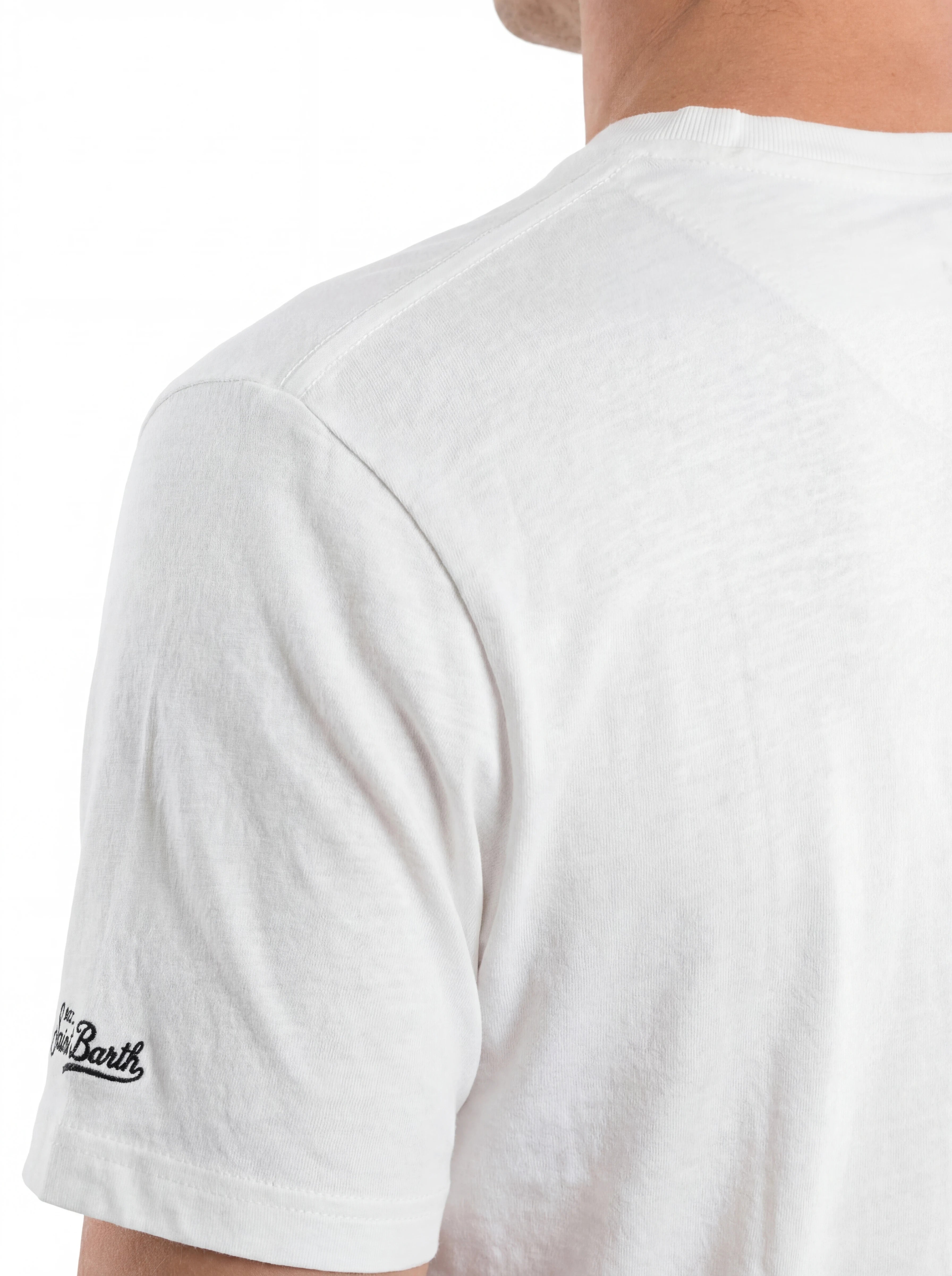 T-shirt su sfondo neutro frontale t-shirt bianco scritta “St. Barth COBRA” Saint Barth cotone