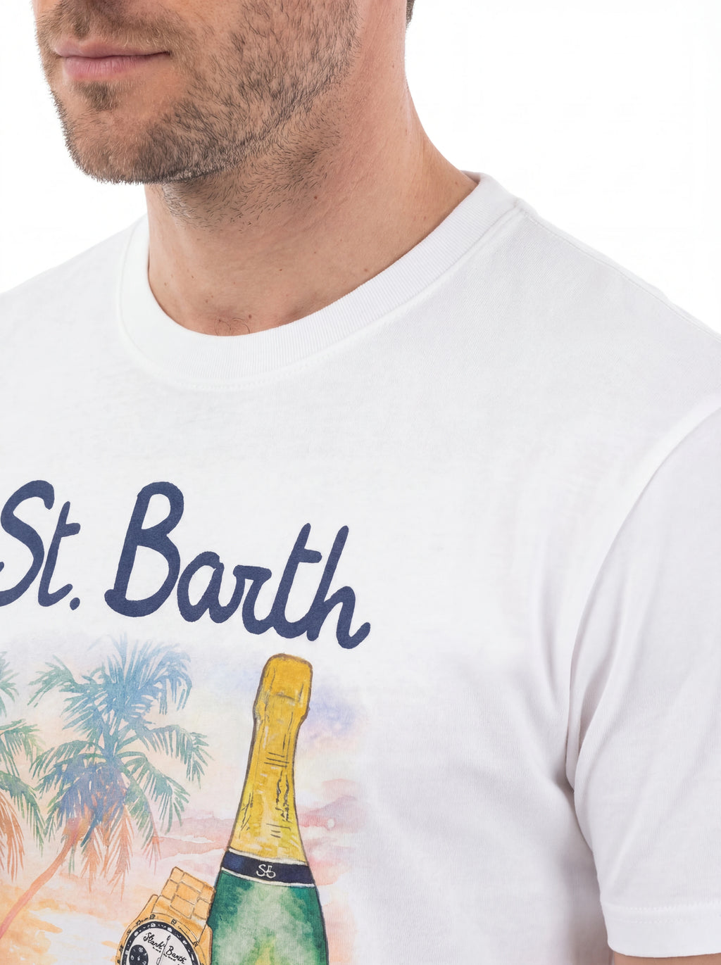 T-shirt su sfondo neutro da dietro t-shirt bianco scritta “St Barth Golden Hour” Saint Barth cotone