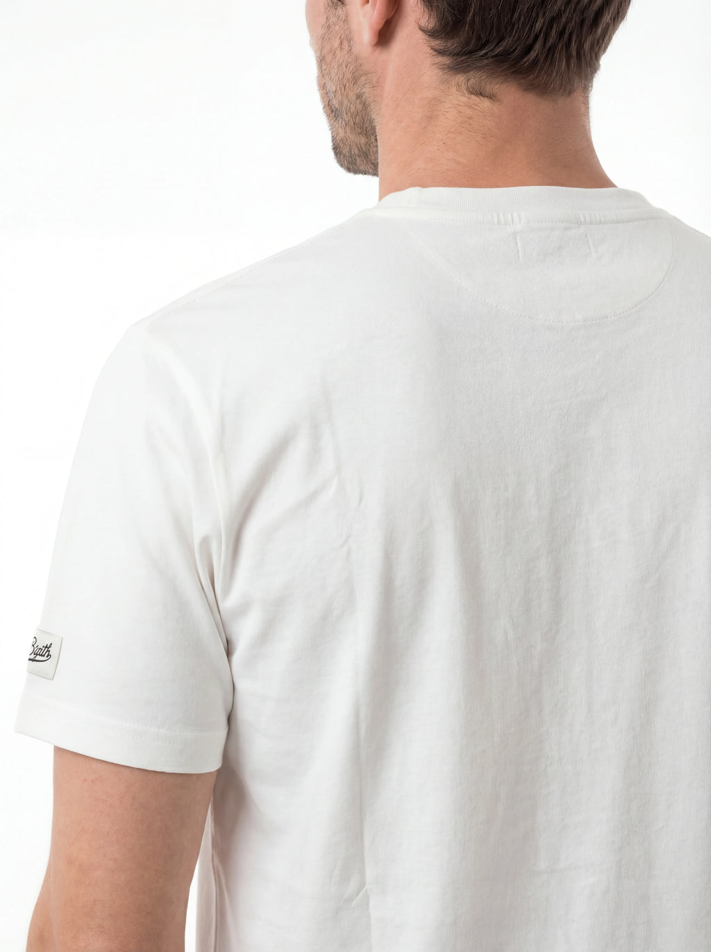 T-shirt su sfondo neutro da dietro t-shirt bianco scritta “APRÈS PADEL” Saint Barth cotone