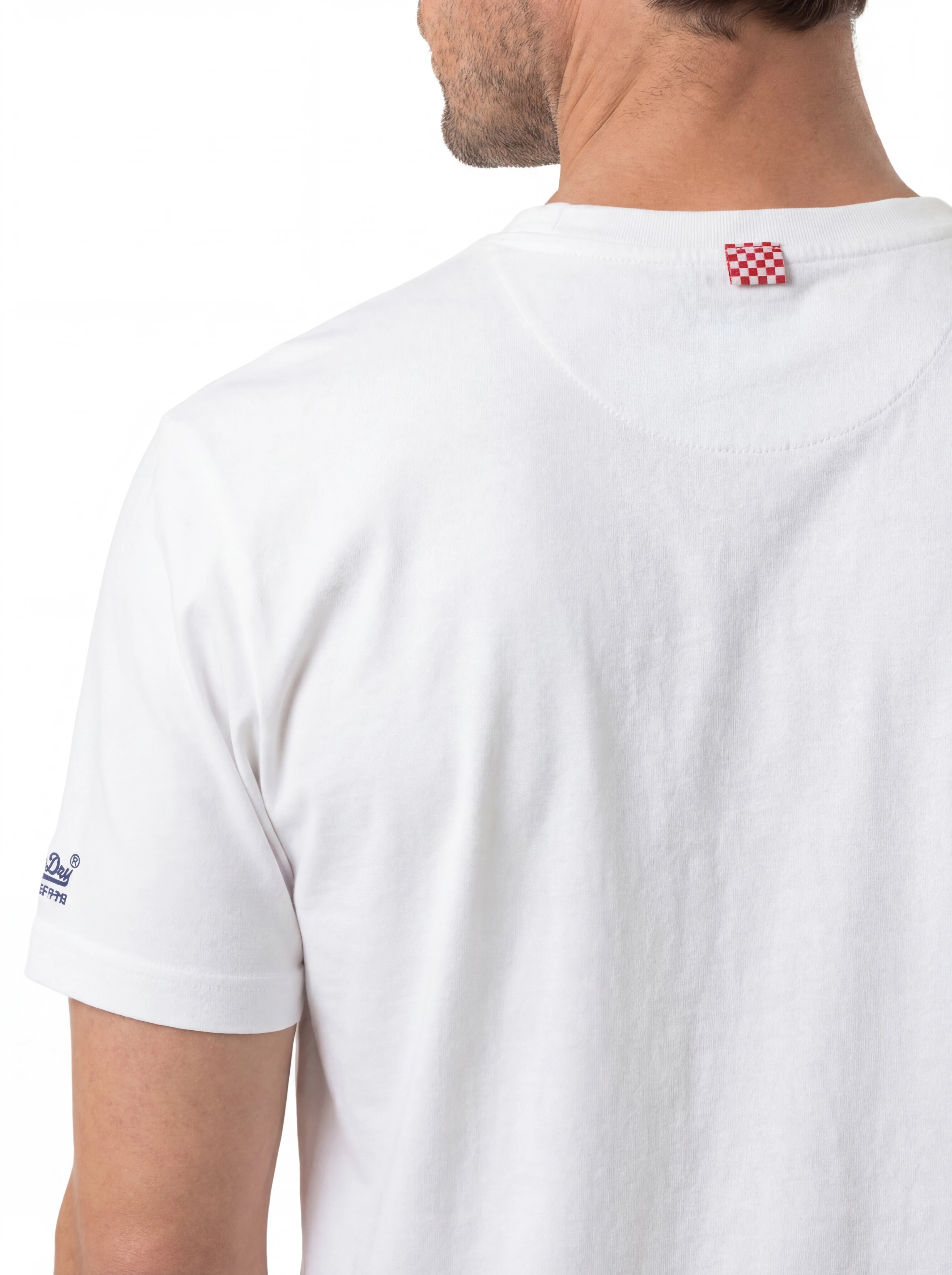 T-shirt su sfondo neutro da dietro t-shirt bianco stampa Saint Barth cotone